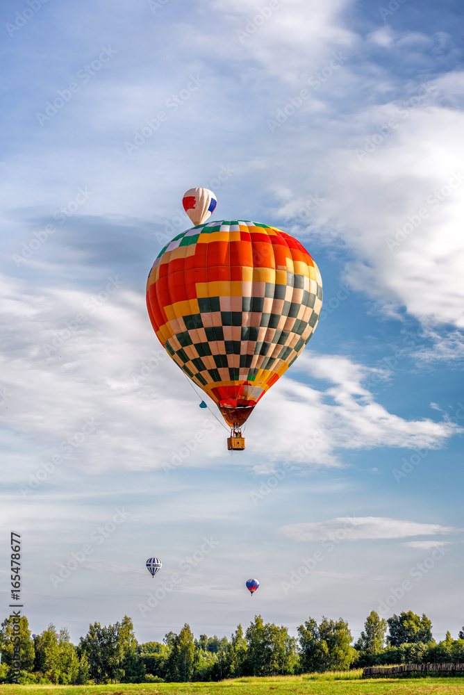 Fototapeta premium Colorful hot air balloons flying in the blue sky. Balloon Festival — The Golden Ring Of Russia — Pereslavl Zalesskiy.