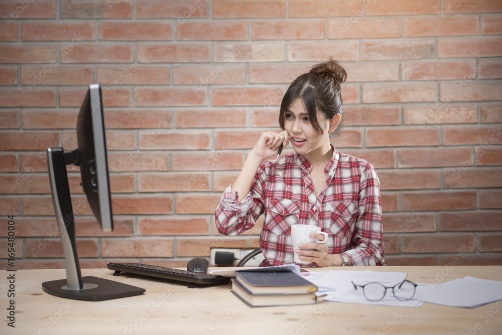 Beautiful woman is working in home office Beautiful woman is working in home office