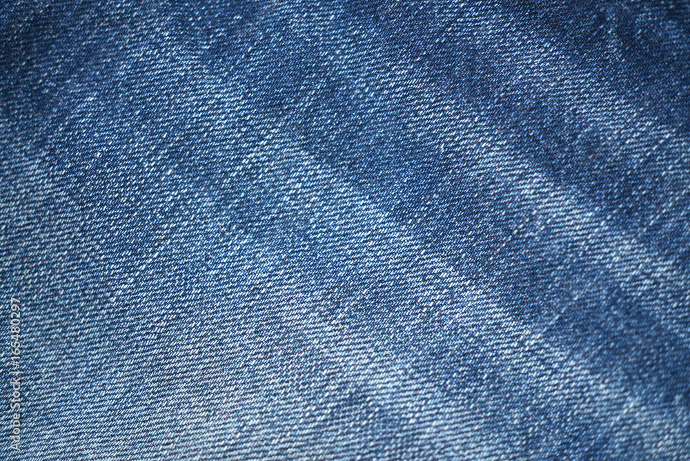 Naklejka premium Blue demin fabric texture background.