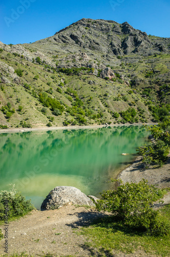 Turquoise color of Lake Panagia, Zelenogorye photo