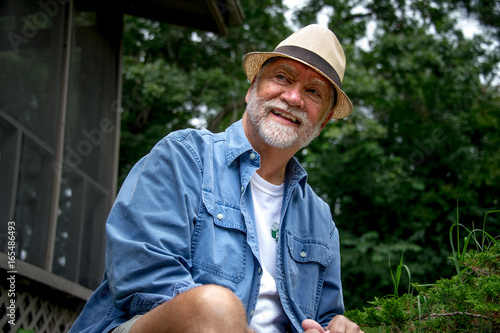 senior man with white beard laughing