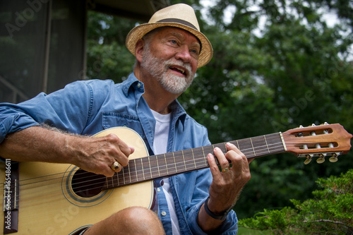 senior man with guitar