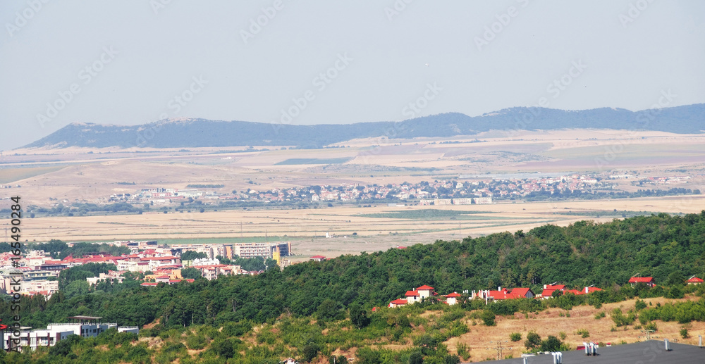 Panorama of the beautiful houses and red roofs of the Balkan mountains nature Bulgaria summer resort