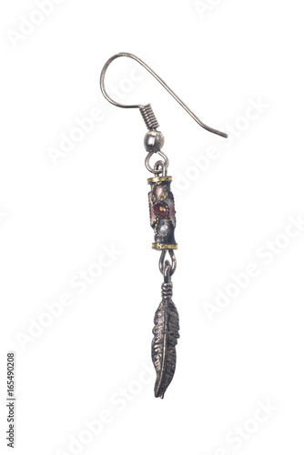 Old blackened silver earrings on white background