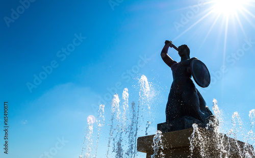 Sculpture of a mermaid in Warsaw near the fountain.  photo