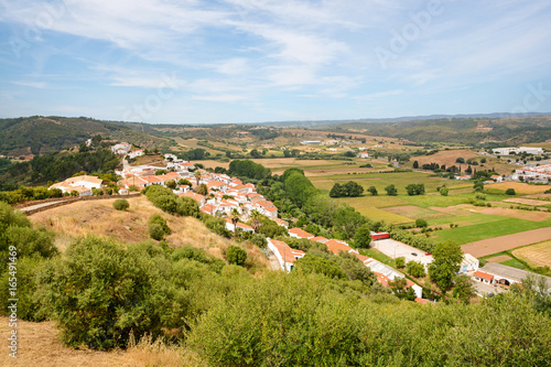 View to the small town of Aljezur with traditional portuguese houses and rural landscape, Algarve Portugal