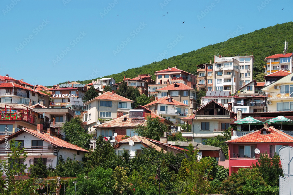 Naklejka premium Panorama of the beautiful houses and red roofs of the Balkan mountains nature Bulgaria summer resort