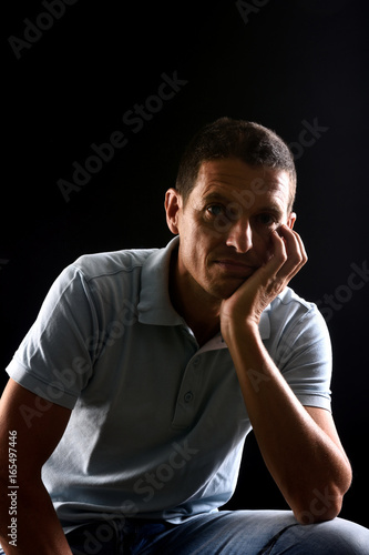 portrai of a man with black background © curto