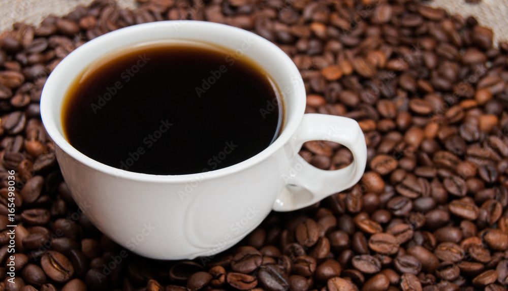 cup of coffee standing on the grains cup of coffee standing on the grains
