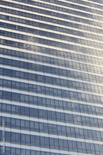 Wall of tall building or glass of skyscraper background.