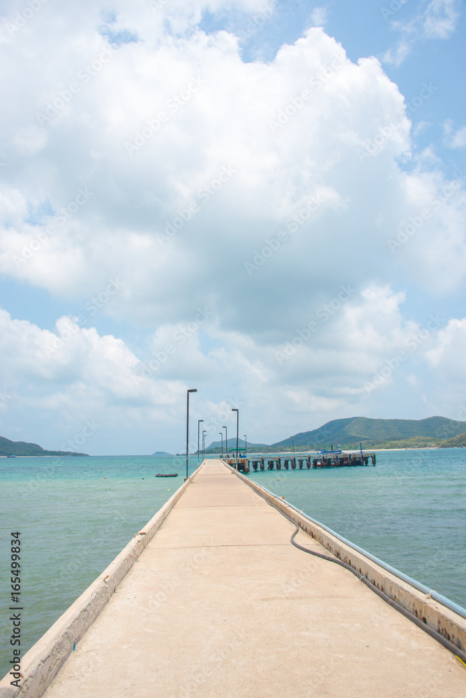 concrete bridge to dock pier in tranquil sea destination ,Samaesan, Chon Buri, Thailand
