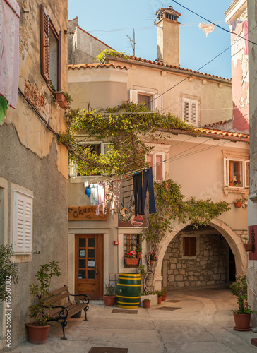 Old houses and archway in Cres