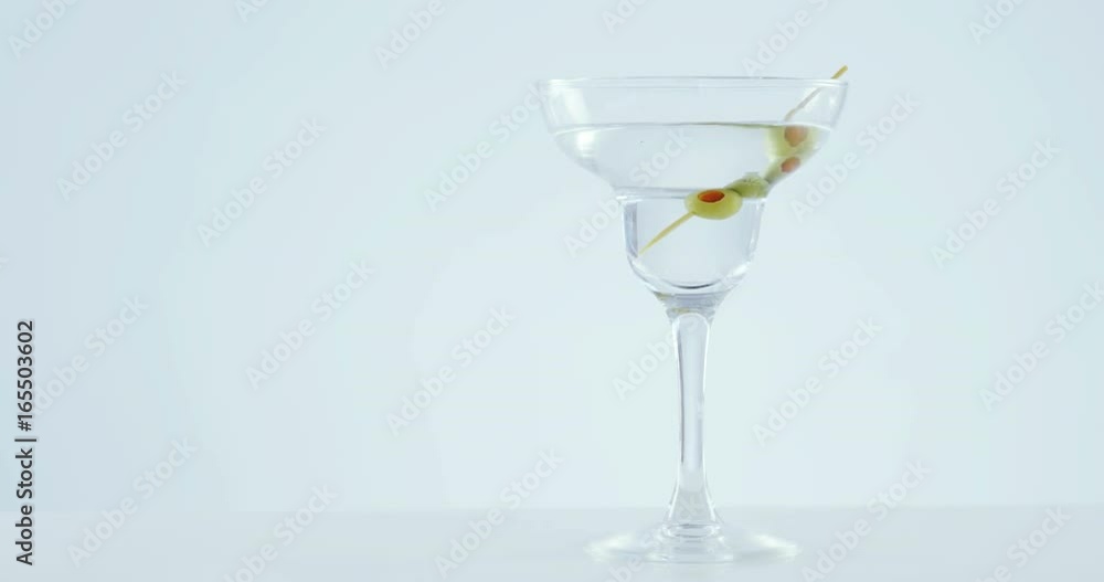 Cocktail glass with olive stick Cocktail glass with olive stick