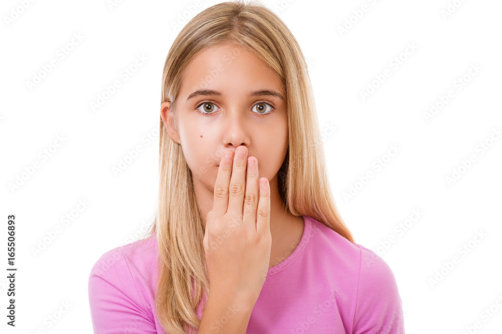 Picture of lovely young girl with hand over mouth.Isolated Picture of lovely young girl with hand over mouth.Isolated