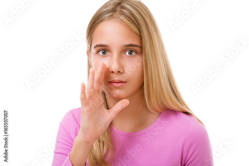 Picture of young girl whispering gossip.Isolated