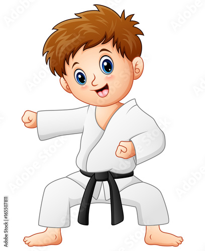 Cute little boy doing karate
