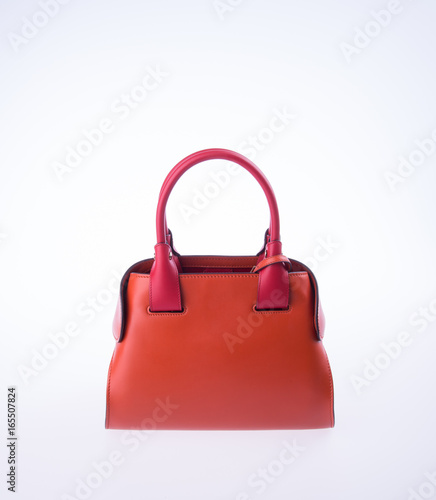 bag or brown leather woman handbag on background.