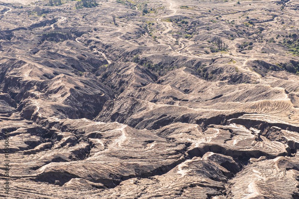 Fototapeta premium Layer Volcanic ash as sand ground of Mount Bromo volcano (Gunung Bromo) in Bromo Tengger Semeru National Park, East Java, Indonesia
