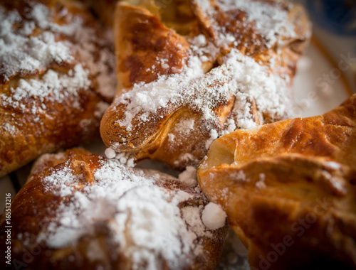 Apple cakes on a tray. Selective focus with shallow depth of field.