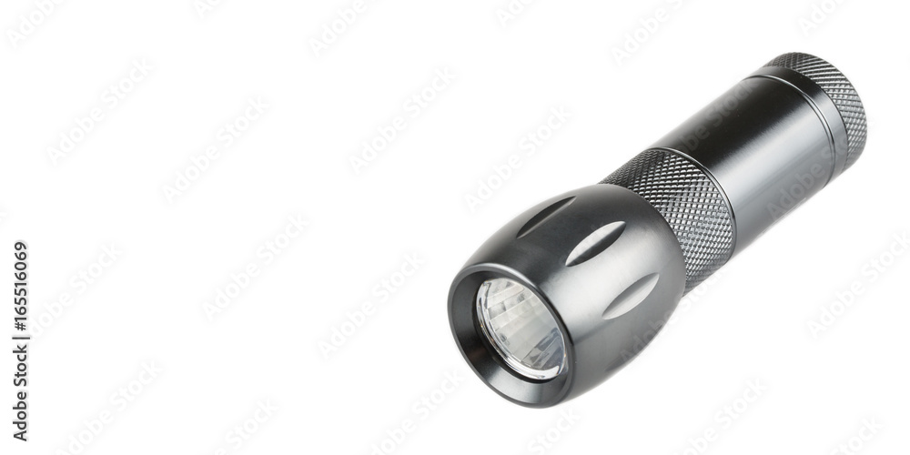 Metal flashlight over white background Metal flashlight over white background