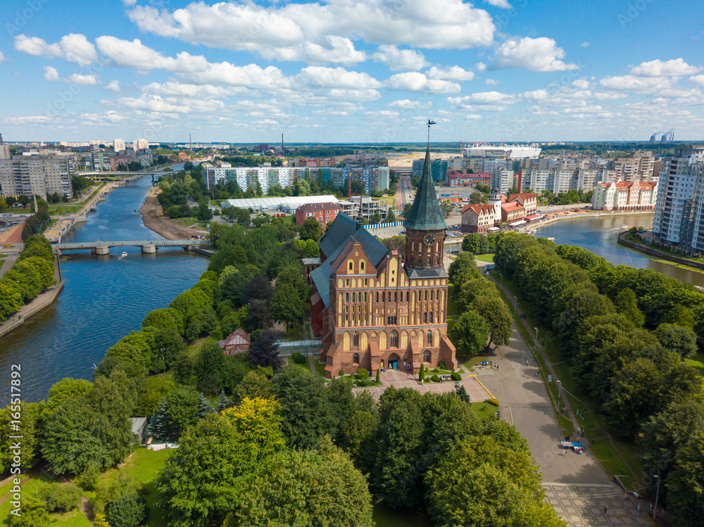 Aerial cityscape of Kant Island in Kaliningrad, Russia at sunny summer day with white clouds in the blue sky
