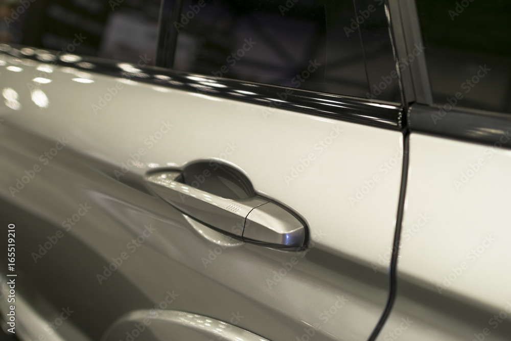 Car door handle of a modern car. Car exterior details