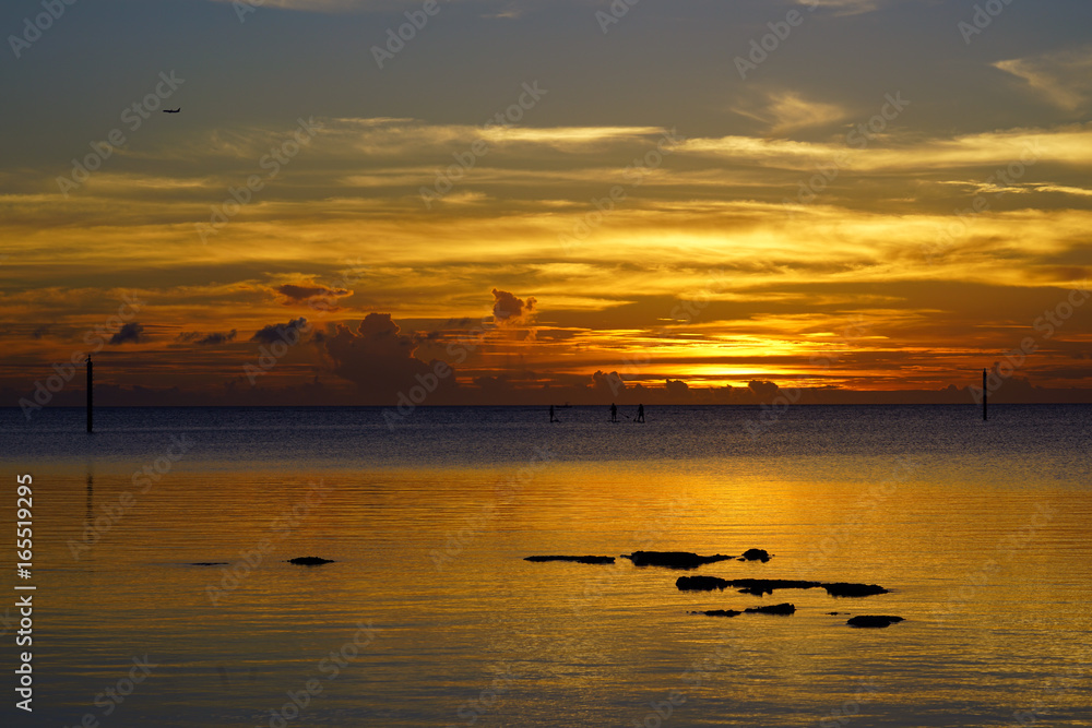 Colorful sunset on a beach in Okinawa, Japan Colorful sunset on a beach in Okinawa, Japan