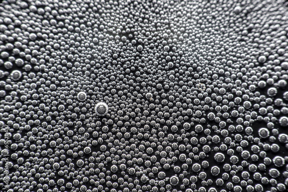 Close up Drop water on black floor Close up Drop water on black floor