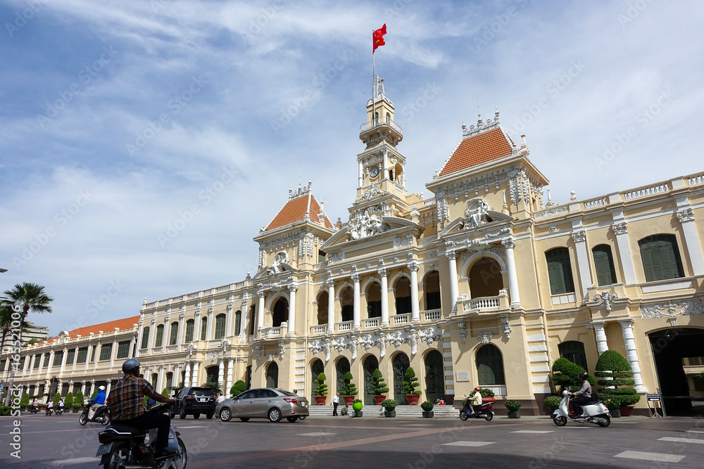 Ho Chi Minh City, Viet Nam - July 11, 2017: The Ho Chi Minh City Hall or Ho Chi Minh City People's Committee in sunny day, built in 1902-1908 in a French colonial style for the then city of Saigon