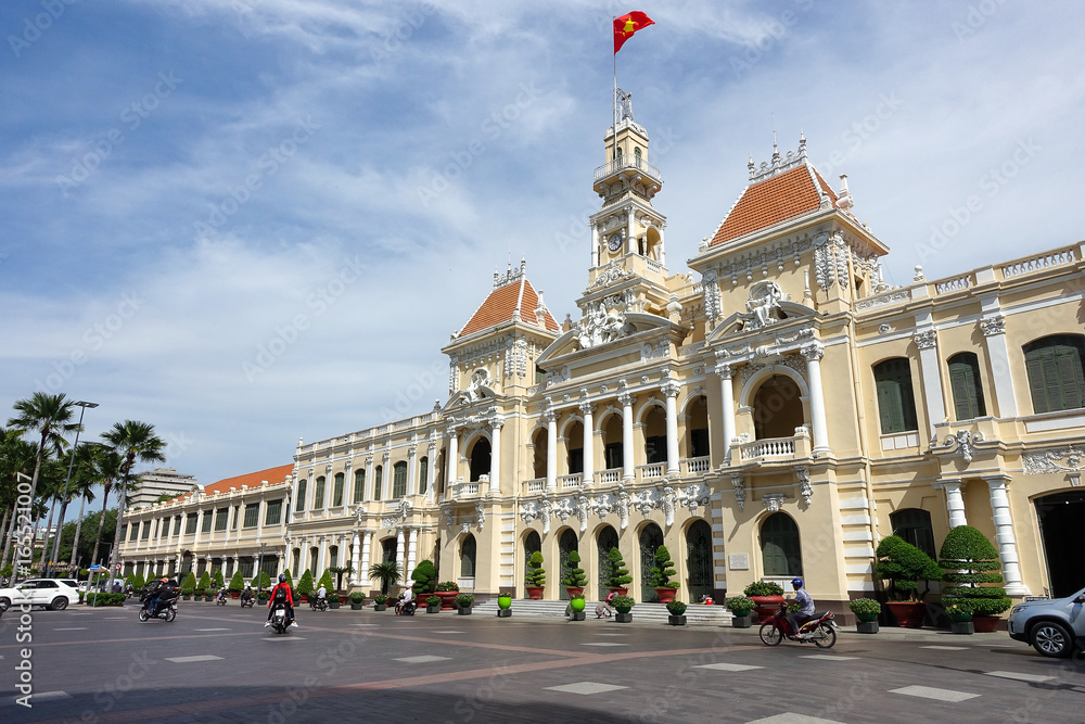 Ho Chi Minh City, Viet Nam - July 11, 2017: The Ho Chi Minh City Hall or Ho Chi Minh City People's Committee in sunny day, built in 1902-1908 in a French colonial style for the then city of Saigon