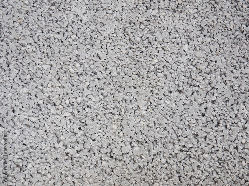 Close up of a porous concrete gray wall empty urban background