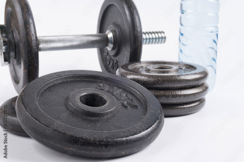 Fitness equipment : Training dumbbells and bottle of water isolated on white background. Fitness equipment : Training dumbbells and bottle of water isolated on white background.