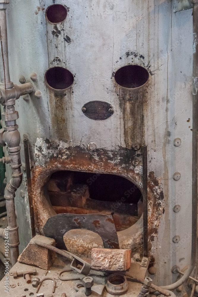 boiler in abandoned steam plant factory that looks like a sad face