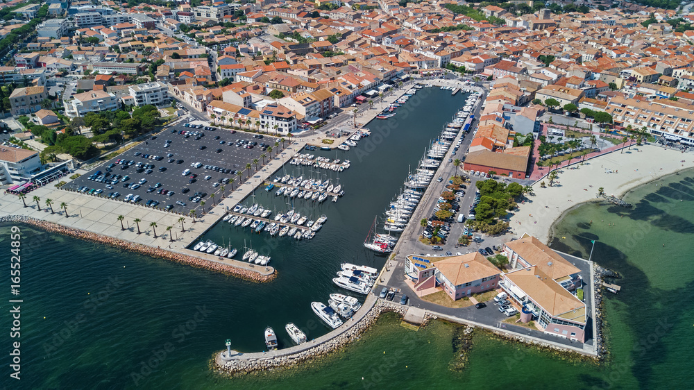 Fototapeta premium Aerial top view of boats and yachts in marina from above, harbor of Meze town, South France