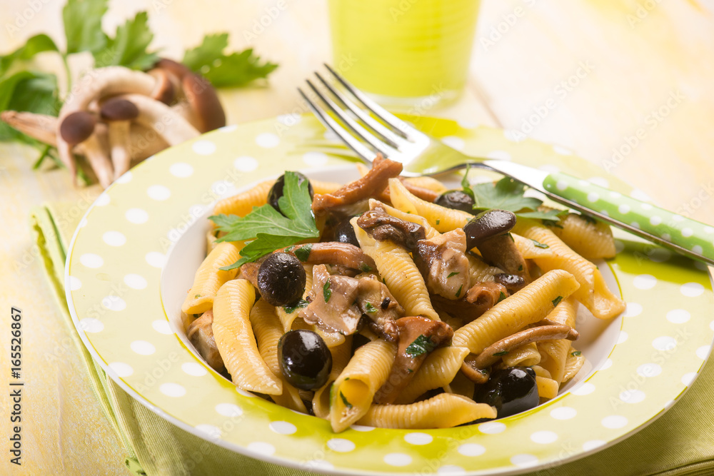 pasta with mushroom and black olives, selective focus pasta with mushroom and black olives, selective focus