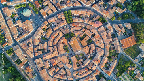 Aerial top view of Bram medieval village architecture and roofs from above, Southern France 