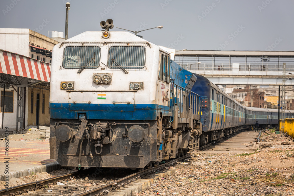 Atrain arriving at the railway station in agra india unesco site.