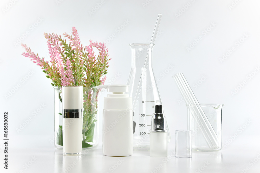 Cosmetic bottle containers with green herbal leaves and scientific glassware, Blank label package for branding mock-up, Research and develop natural organic beauty skincare product concept. Cosmetic bottle containers with green herbal leaves and scientific glassware, Blank label package for branding mock-up, Research and develop natural organic beauty skincare product concept.