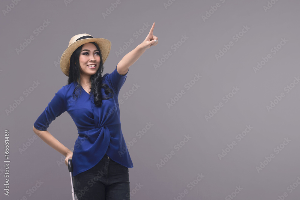 Portrait of asian woman tourist carrying suitcase Portrait of asian woman tourist carrying suitcase