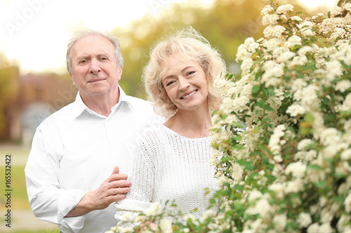 Happy senior couple near bl...