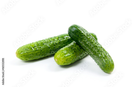 Fresh green cucumber on the white background.
