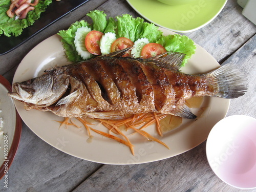 Fried snapper with chili sauce on the plate