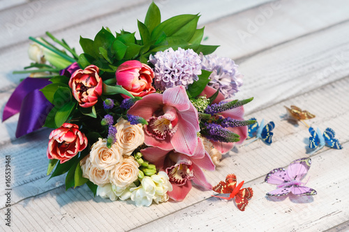Bouquet of Tulips, roses, wildflowers wooden table, spase for text
