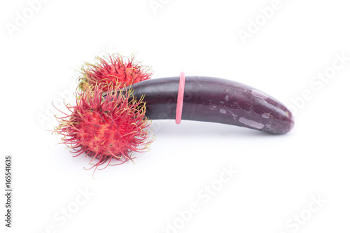 abstract condom with eggplants and rambutan isolated on white background