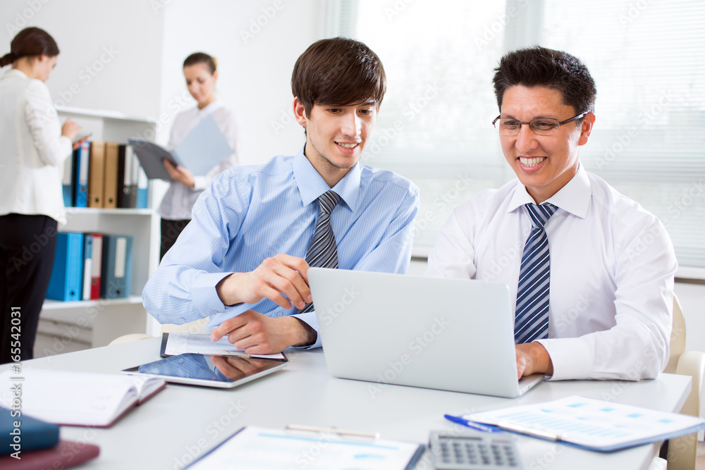 Two young businessmen discussing a new project Two young businessmen discussing a new project