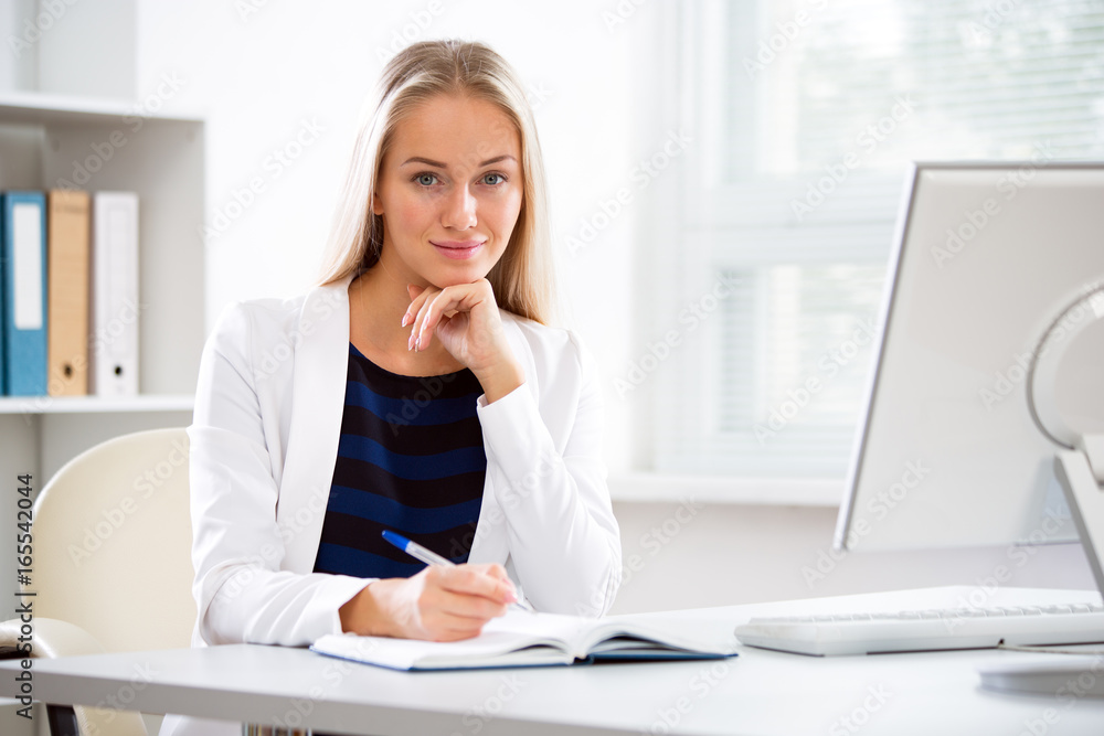 Young business woman using computer at office Young business woman using computer at office