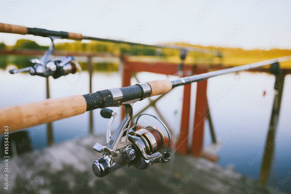 Abstract view of fishing, lake in background, summer sunset Abstract view of fishing, lake in background, summer sunset