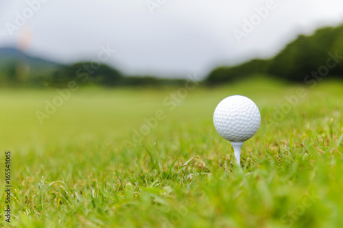 Close up of Golf ball on tee on golf course