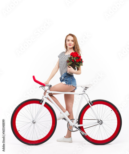 Model with flowers and bicycle