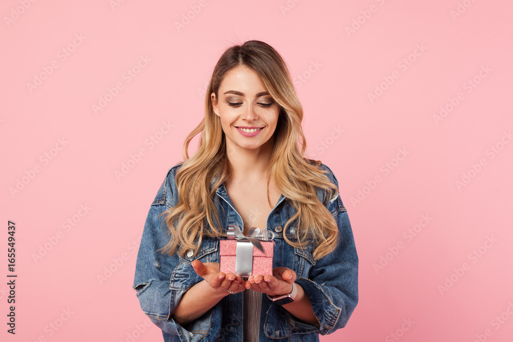 Beautiful woman posing with small giftbox Beautiful woman posing with small giftbox
